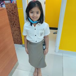 Portrait of girl standing on floor