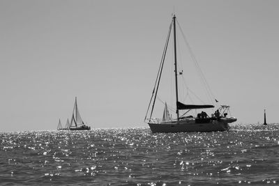 Boats sailing in sea