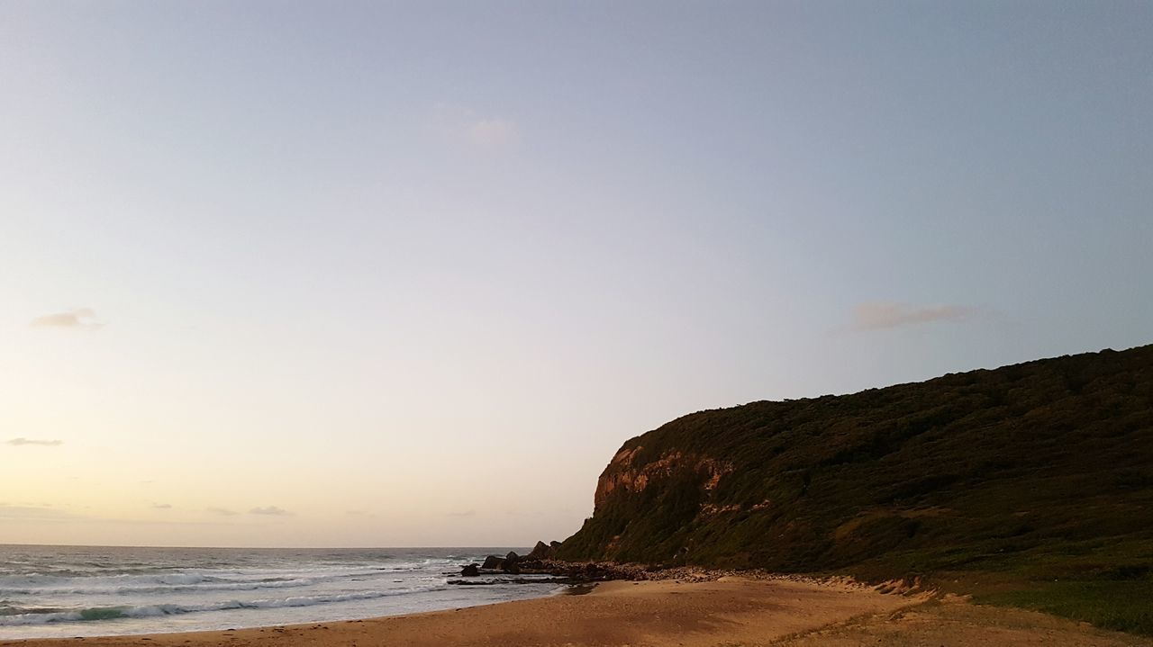 sea, horizon over water, beach, water, tranquil scene, scenics, tranquility, copy space, clear sky, beauty in nature, shore, sand, nature, idyllic, coastline, sky, remote, rock - object, non-urban scene, rock formation