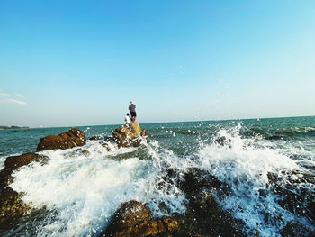 Scenic view of sea against clear sky