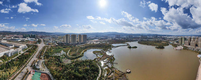 High angle view of buildings in city against sky