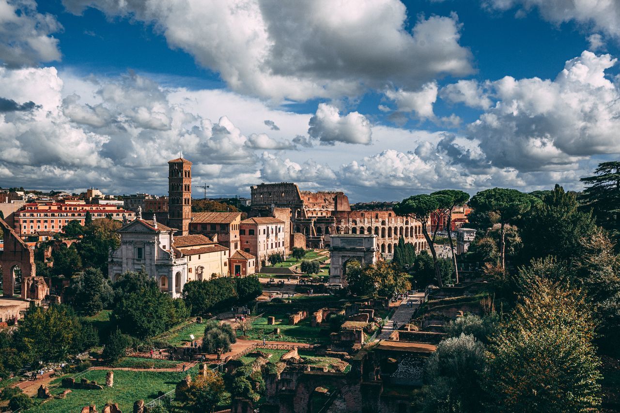 building exterior, architecture, built structure, cloud - sky, sky, tree, building, plant, nature, city, day, residential district, no people, history, ancient, the past, outdoors, travel destinations, old, travel, ancient civilization, cityscape, archaeology