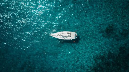 High angle view of sailboat on sea during sunny day