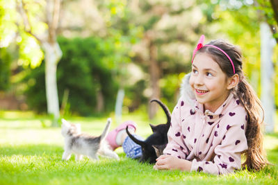 Portrait of woman with dog in park