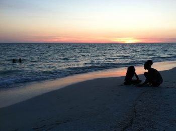 Scenic view of sea at sunset