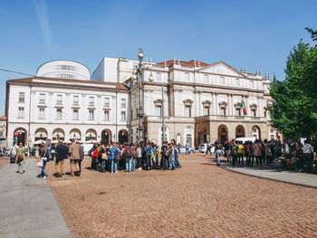 Group of people on building in city