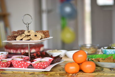 Fruits in plate on table