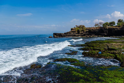 Scenic view of sea against cloudy sky