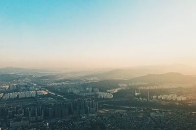 Aerial view of cityscape against clear sky