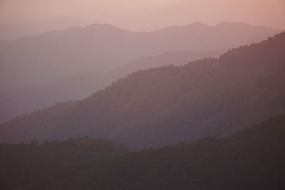 Scenic view of silhouette mountains against sky