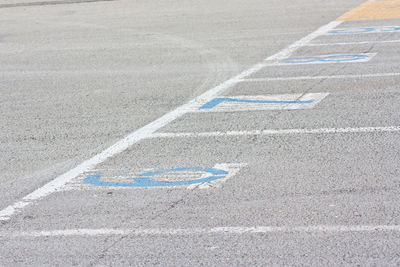 High angle view of arrow sign on road