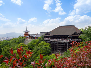 View of temple against building and sky