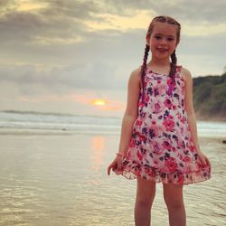 Portrait of woman standing on beach