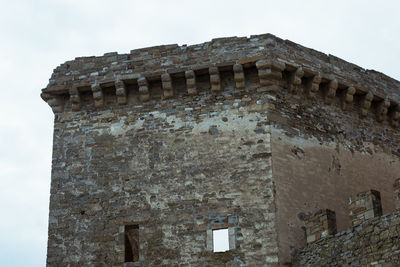 Low angle view of old building against sky