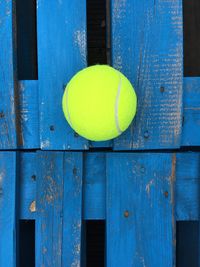 Directly above shot of tennis ball on blue table