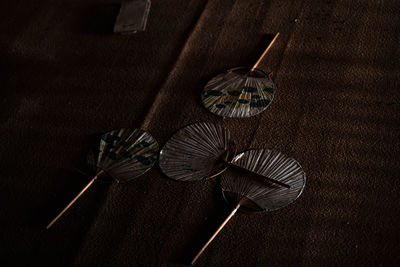 High angle view of hand fans on table