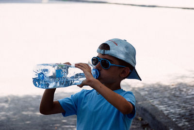 Boy drinking water from bottle