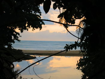 Scenic view of sea against sky at sunset