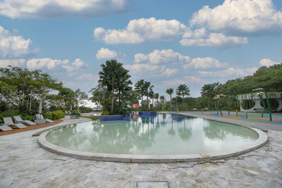 Luxurious tropical pool with sunbed