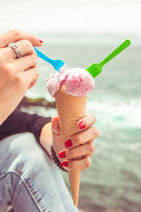 Hand holding ice cream cone