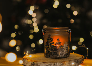 Close-up of illuminated christmas lights on table