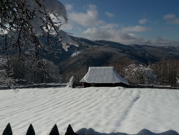 Scenic view of snowcapped mountains against sky