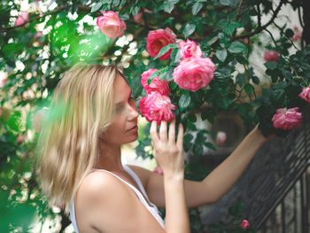 Portrait of woman with pink flowers