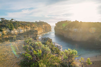 Scenic view of lake against sky at sunset