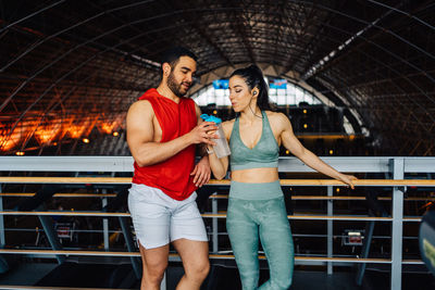 Portrait of young couple in love having a special moment in gym clothes