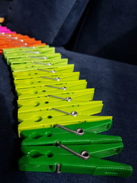 High angle view of colorful clothespins arranged on table