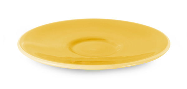 High angle view of yellow cup over white background