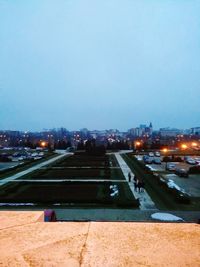 High angle view of illuminated city against sky