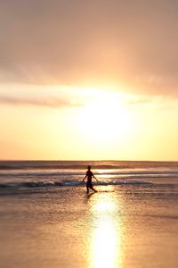Scenic view of sea at sunset