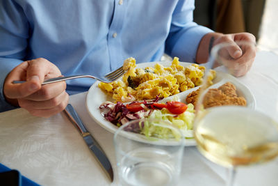 Midsection of man having food