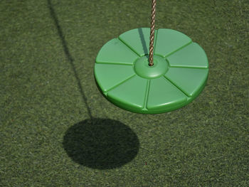 High angle view of toy hanging on grass