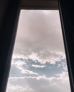 Low angle view of sky seen through window