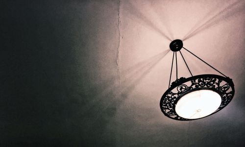 Low angle view of illuminated lamp