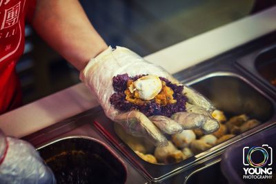 Close-up of man holding food