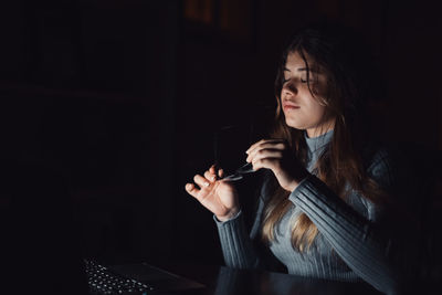 Young woman using mobile phone