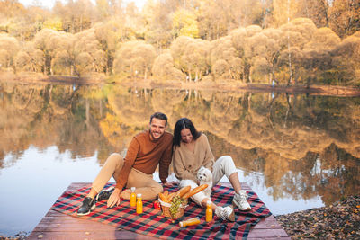 Young couple sitting outdoors