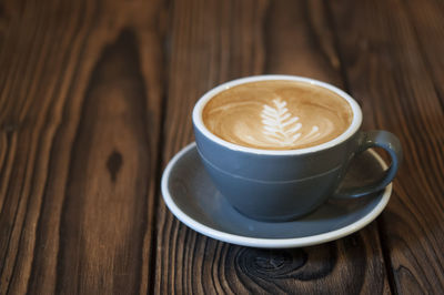 Close-up of cappuccino on table