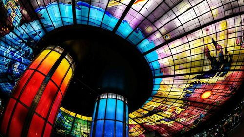 Low angle view of illuminated modern building