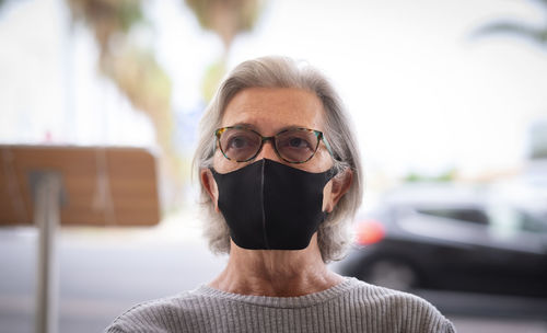 Portrait of senior woman wearing mask