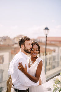 Happy young couple standing outdoors