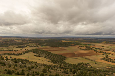 Scenic view of agricultural landscape against sky