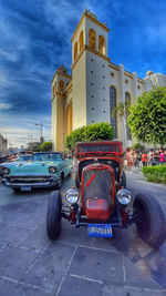 Cars on street against buildings in city