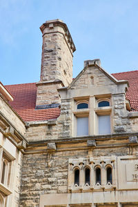 Low angle view of old building against clear sky