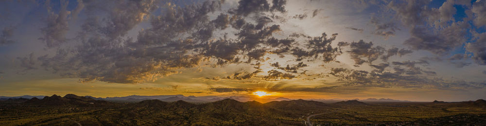 Scenic view of landscape against sky during sunset
