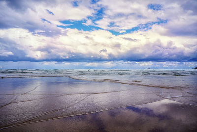 Scenic view of beach against sky