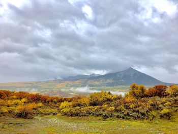 Scenic view of landscape against sky during autumn